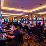 8kbet players celebrating wins at colorful slot machines in an exciting casino environment